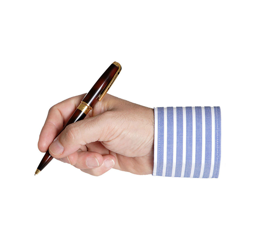 person writing with a pen