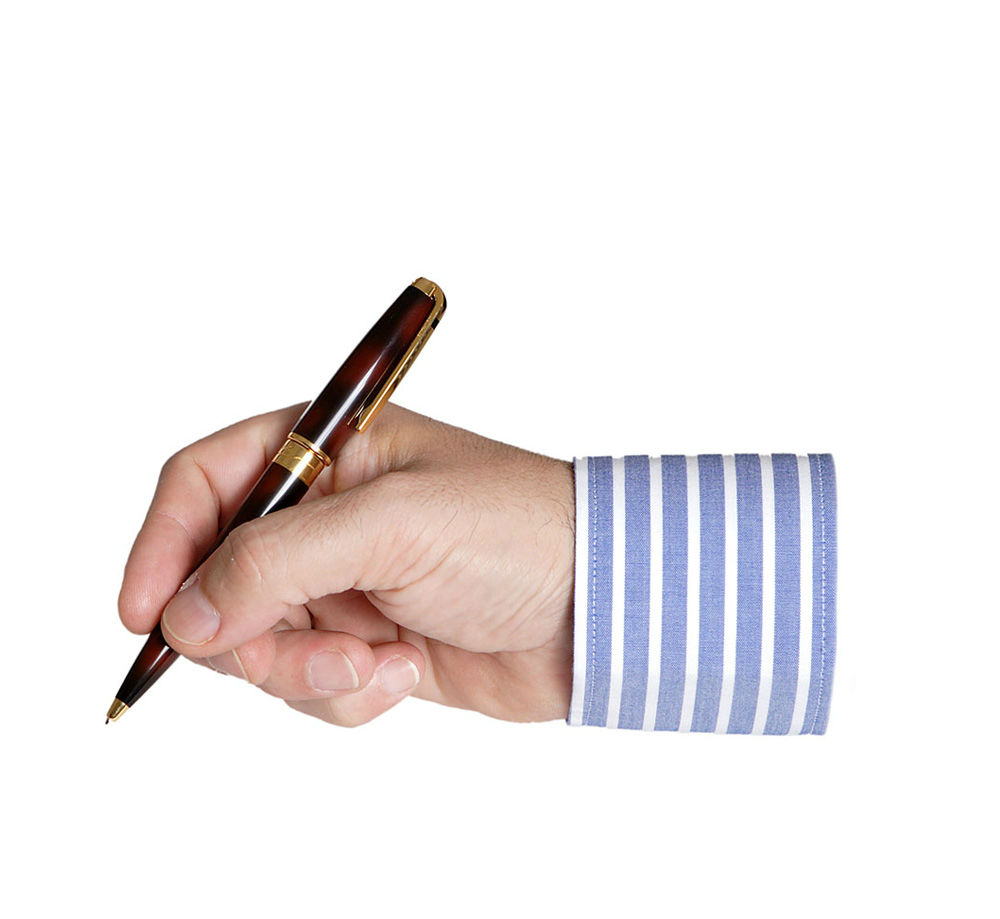 person writing with a pen