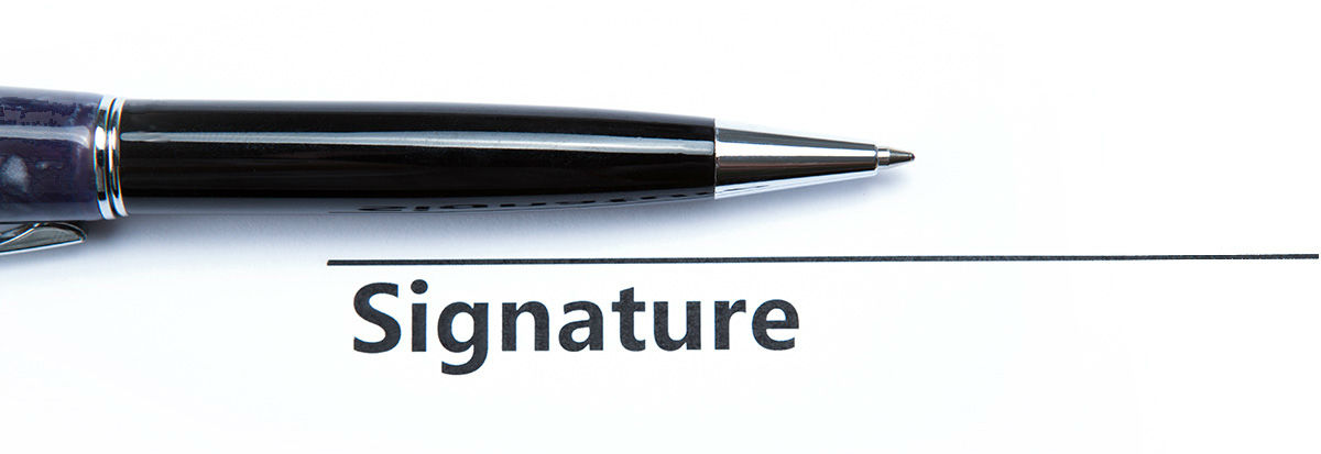 pen and signature on paper